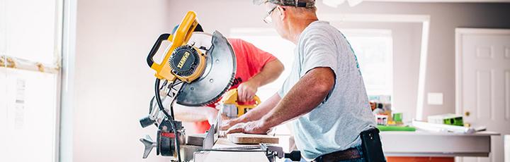 Men working with mitar saw